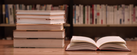 books neatly placed on the desk